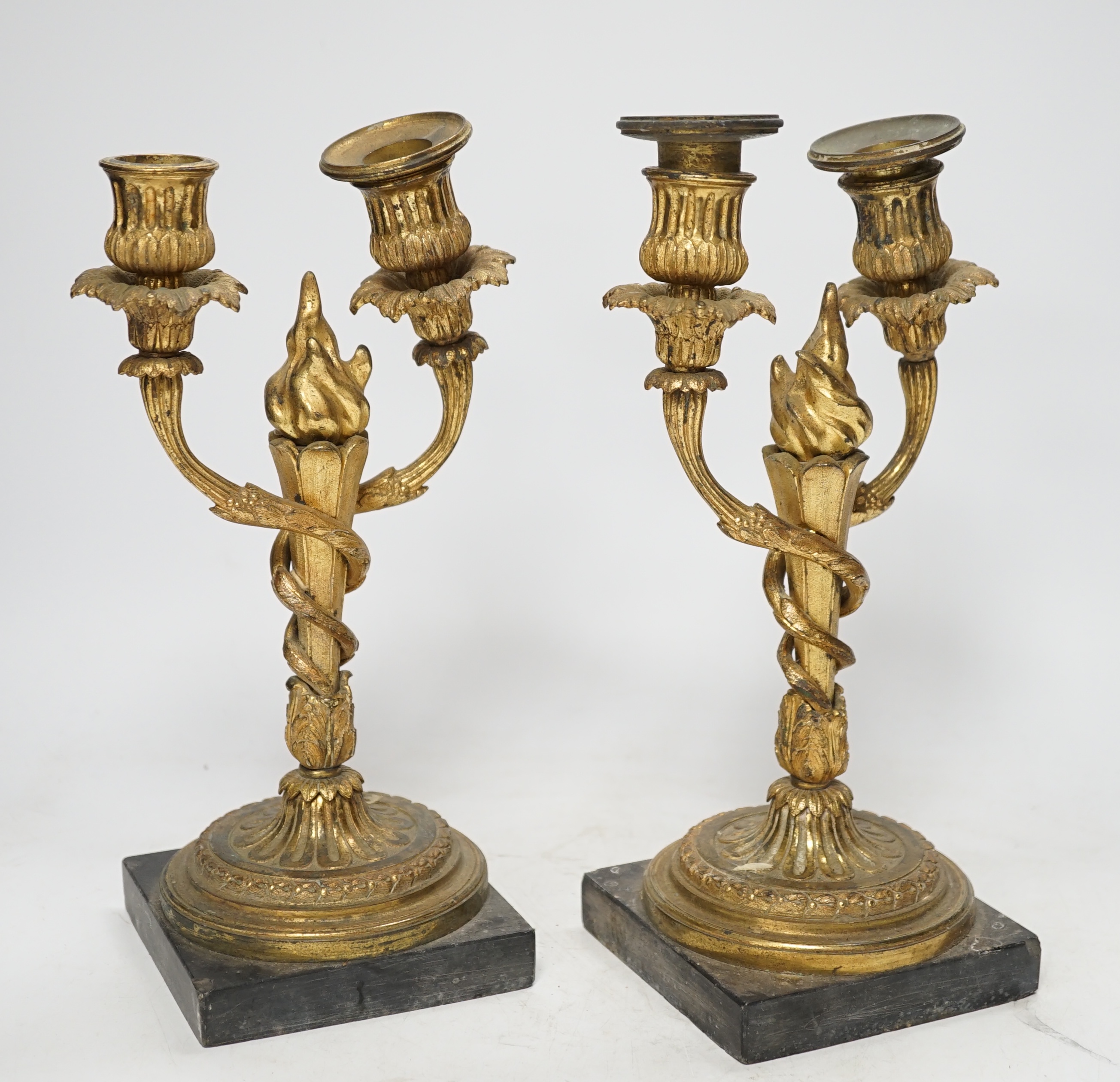 A pair of 19th century Louis XVI style gilt metal twin branch candelabra, 27cm. Condition - poor to fair